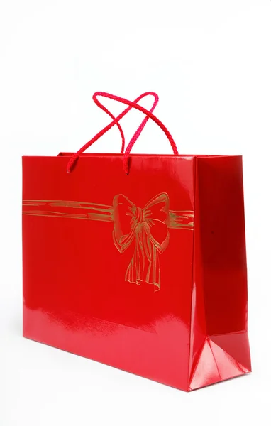Fehér alapon piros ajándék táska. — Stock Fotó