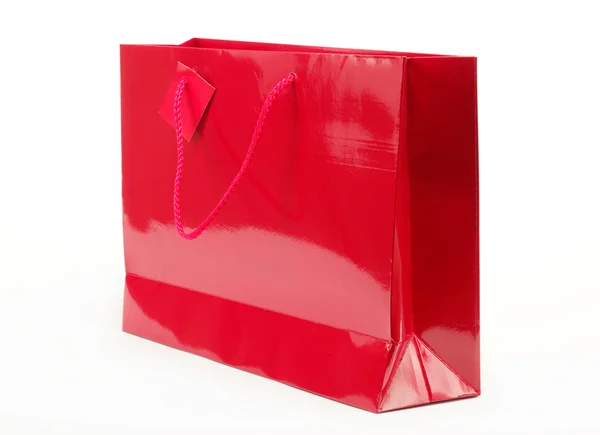 Röda gåva väska på en vit bakgrund. — Stockfoto