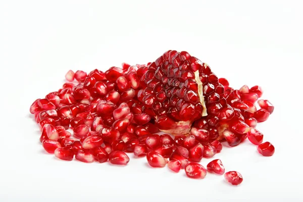 Pomegranate seeds on a white background Stock Image
