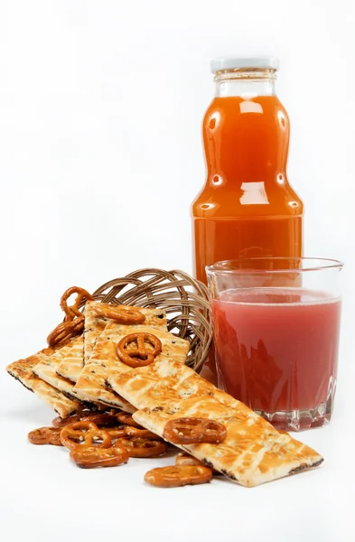 Light lunches. Crunchy biscuits and juice on a white background. — Stock Photo, Image
