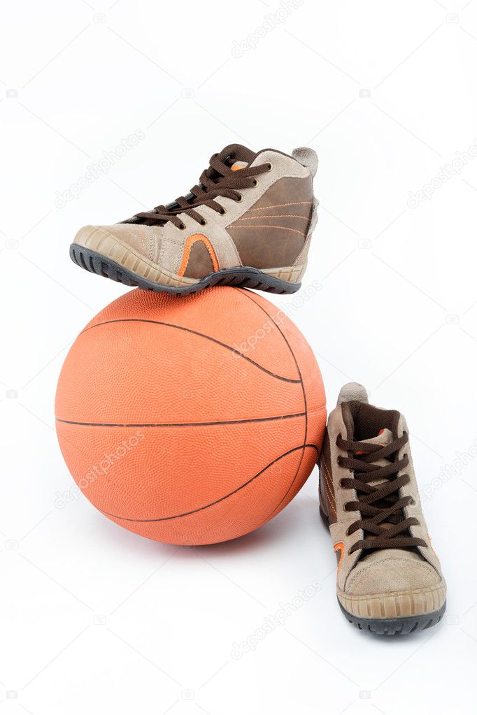 The new sports shoes with the ball on a white background.