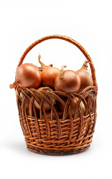 Fresh bulbs of onion in basket on a white background — Stock Photo, Image