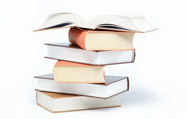 Una pila de libros sobre un fondo blanco . — Foto de Stock