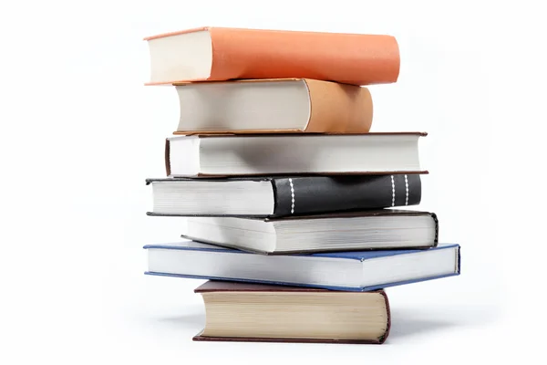 A stack of books on a white background. — Stock Photo, Image
