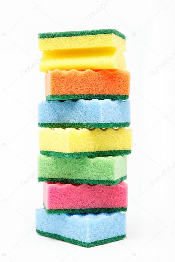 Stack of cleaning sponges on a white background.