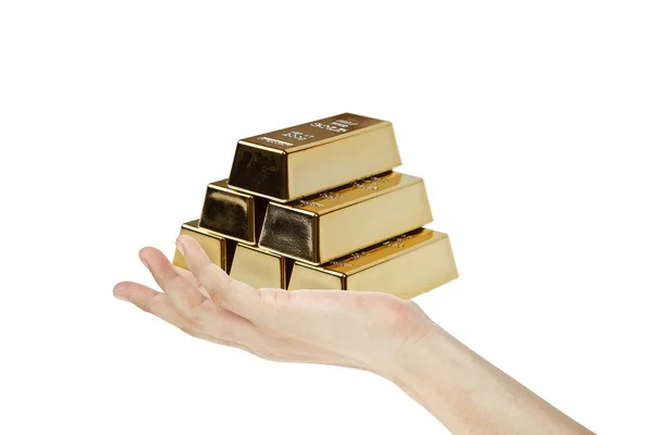 Goldbarren in der Hand — Stockfoto