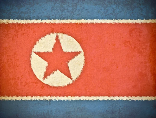 Gamla grunge paper med Nordkorea flagga bakgrund — Stockfoto