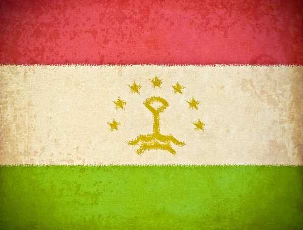 Old grunge paper with Tajikistan flag background — Stockfoto