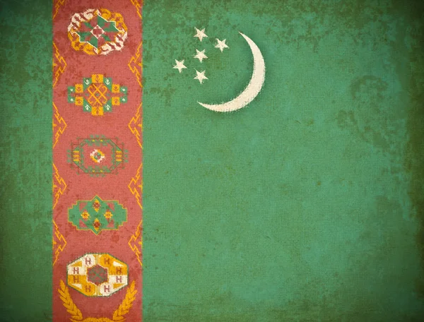Türkmenistan bayrağı geçmişi olan eski bir grunge kağıt — Stok fotoğraf