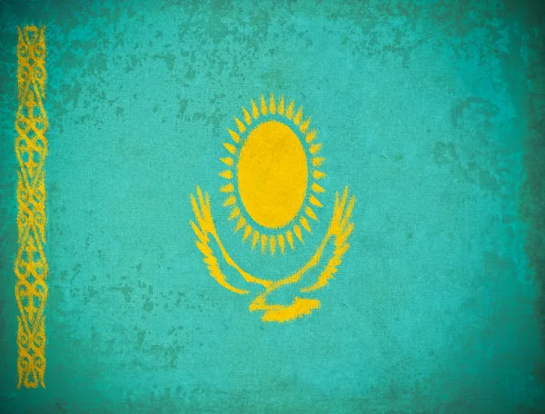 Gamla grunge paper med Kazakstan flagga bakgrund — Stockfoto