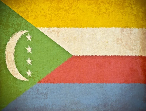 Gamla grunge paper med Komorernas flagga bakgrund — Stockfoto