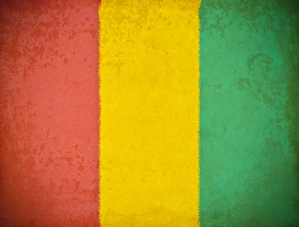 Vieux papier grunge avec fond drapeau de Guinée — Photo