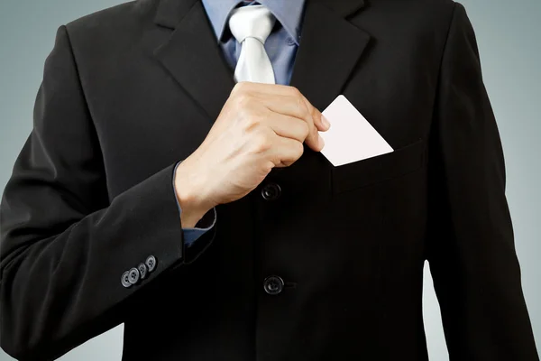 Business man holding blank business card isolated on white — Stock Photo, Image