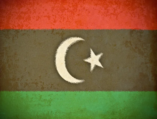 Oud grunge papier met Libië vlag achtergrond — Stockfoto