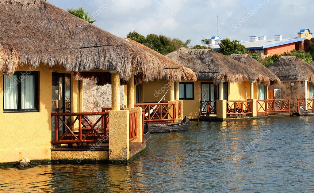 Tropical beach houses in Mexico — Stock Photo © alexsvirid 10051518