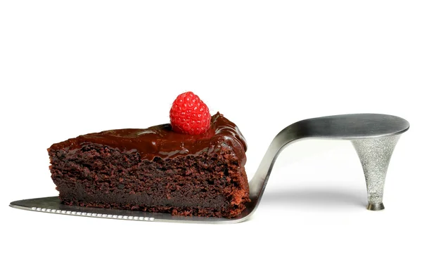 stock image A slice of chocolate cake with raspberry on shoe cake server