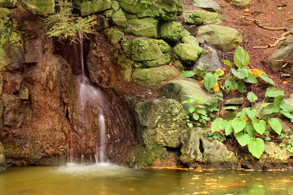 stock image Little waterfall in the rocks.