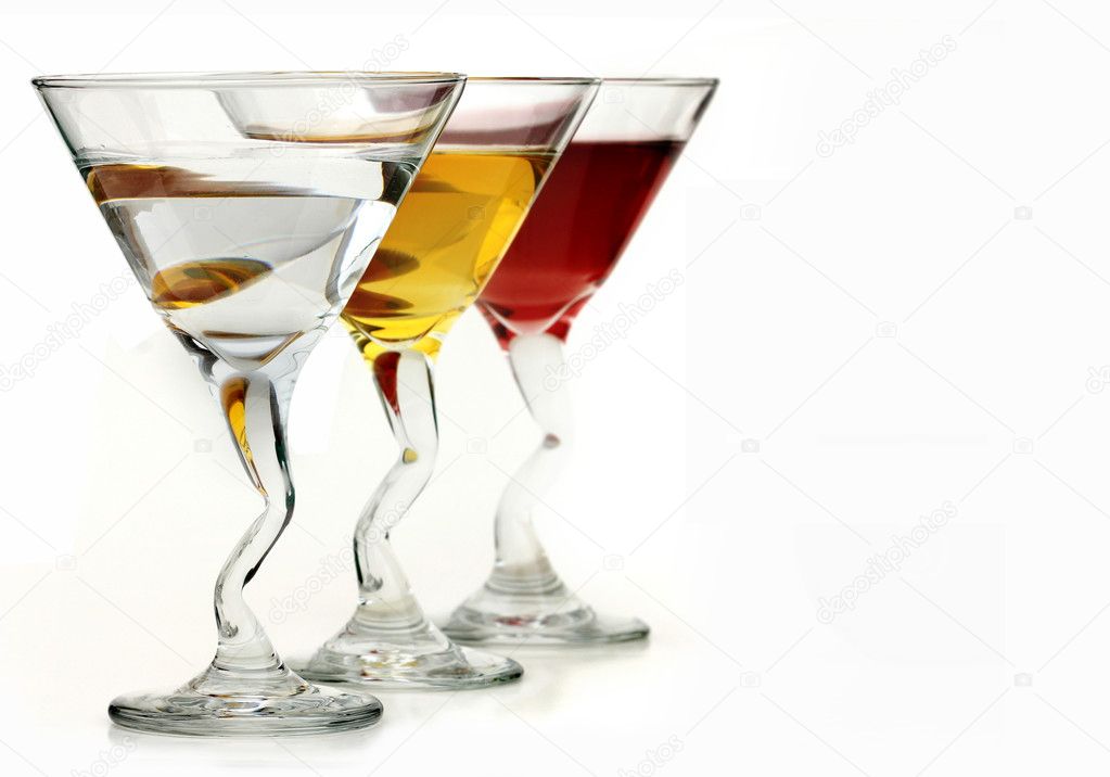 Three elegant crystal cocktail glasses isolated on white