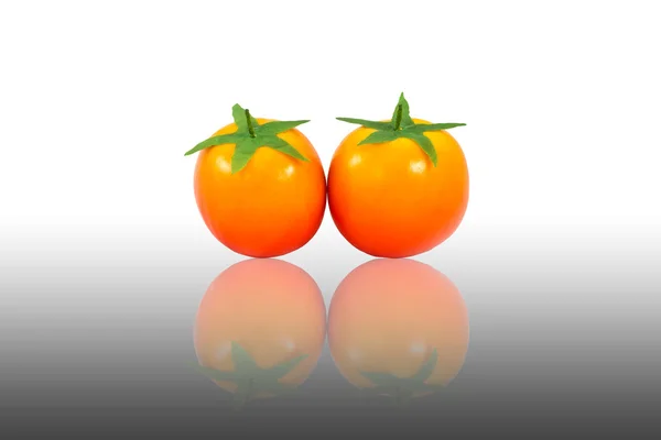 Plastic tomato reflection — Stock Photo, Image