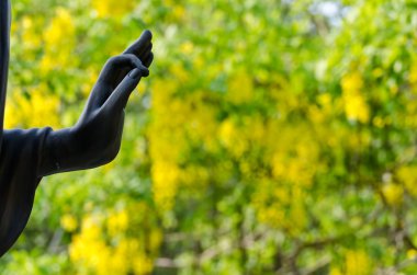 Hand of Buddha statue in Thailand's temple clipart