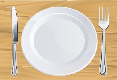 Plate and cutlery on wooden table clipart