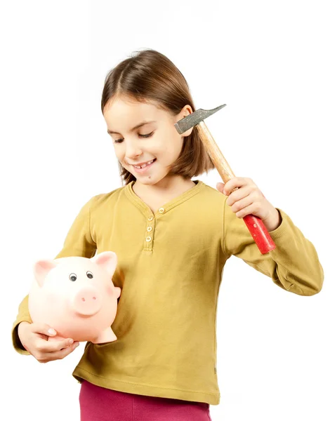 Little girl breaking a piggy bank — Stock Photo, Image