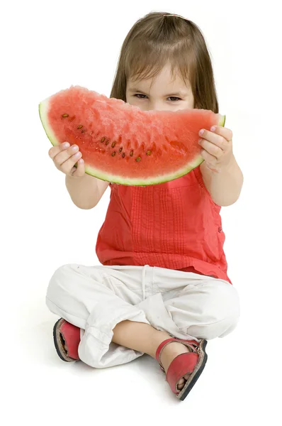 Kislány eszik görögdinnyét — Stock Fotó