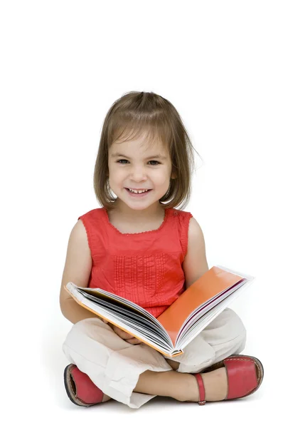A kislány könyvet olvas. — Stock Fotó