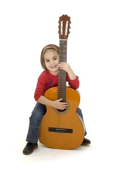 Klein meisje spelen akoestische gitaar — Stockfoto