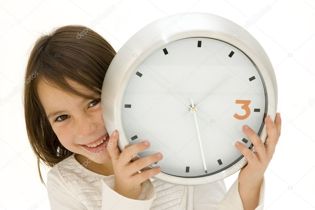 Little girl behind a clock