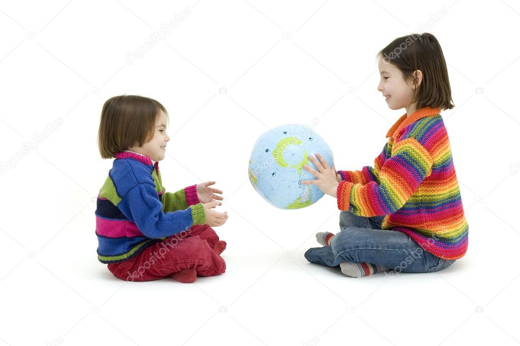 Two children embracing the world globe