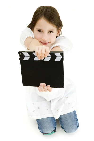 Young girl holding a movie clapper — Stock Photo, Image