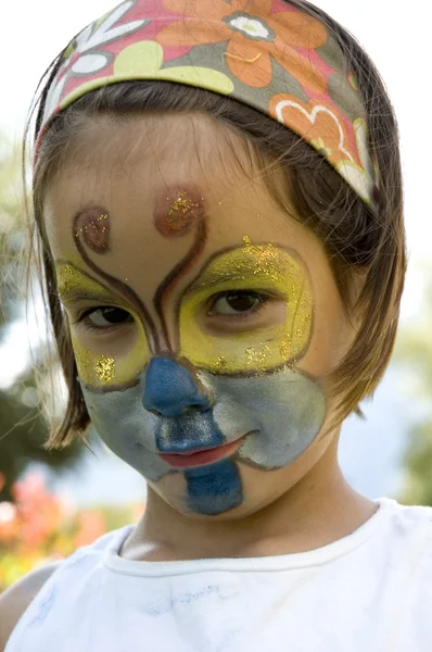 Dziewczynka z motyl makijaż — Zdjęcie stockowe