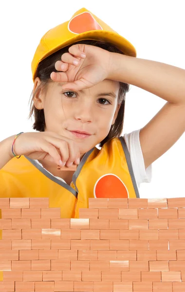 Little girl building a wall isolated on white background — Stock Photo, Image