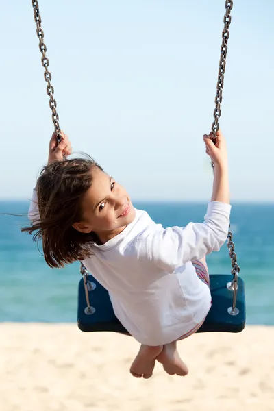 Little girl swinging — Stock Photo, Image
