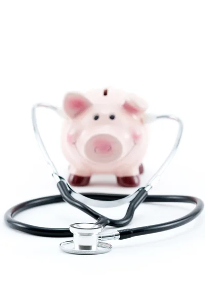 Piggy bank with stethoscope — Stock Photo, Image