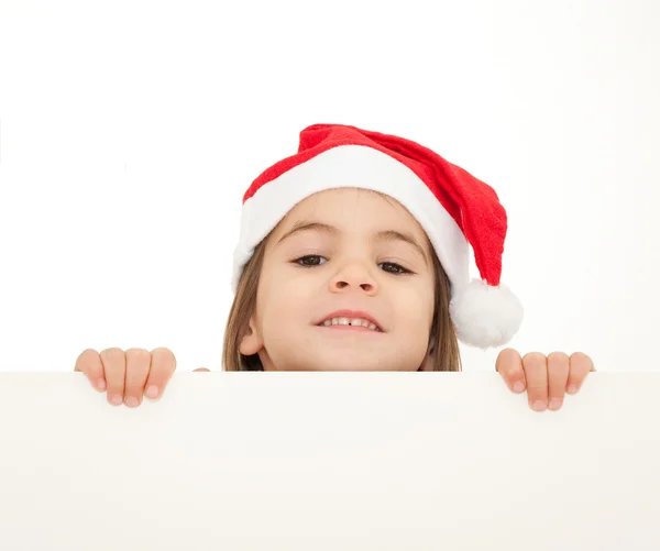 Little girl with santa hat holding a white banner — Stock Photo, Image