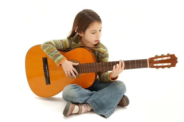 Young girl playing acoustic guitar — Stock Photo, Image