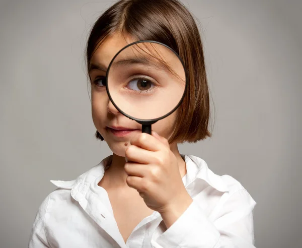 Looking through magnifying glass — Stock Photo, Image