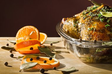 Roasted duck with orange fruit serve on wooden table clipart