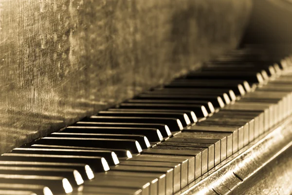 Old vintage piano in sepia toned — Stock Photo, Image
