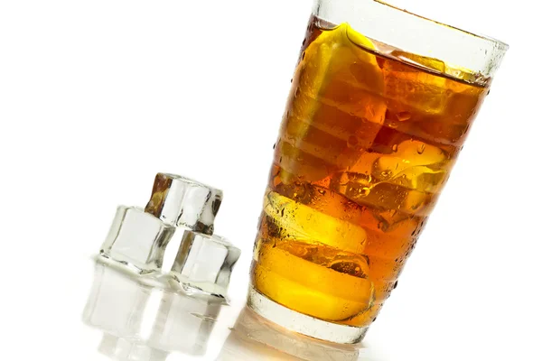 Cold tea in glass and ice cube — Stock Photo, Image