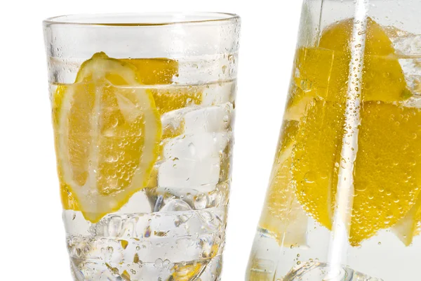 Closeup glass with ice cubes and lemon — Stock Photo, Image