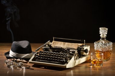 Retro-Styled old typewriter, cigar, hat and whisky with carafe clipart