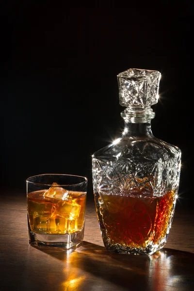 Whisky on ice and glass carafer — Stock Photo, Image