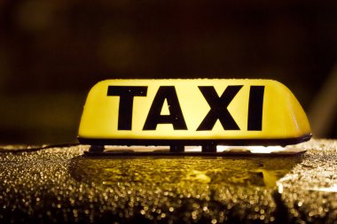 Taxi sign in rainy day clipart