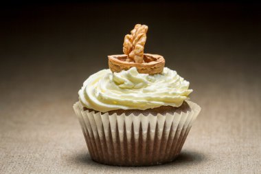 Chocolate muffin with walnut looking like boat clipart