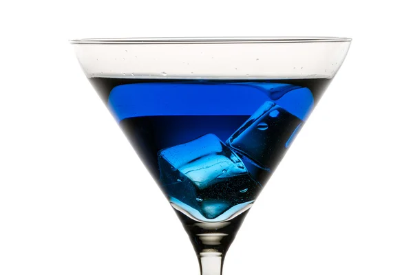 Martini glass with ice and blue liqueur — Stock Photo, Image