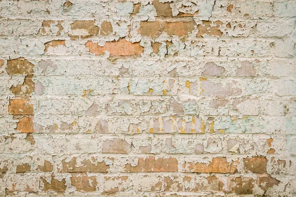 Vieja pared de ladrillo con pintura pelada —  Fotos de Stock