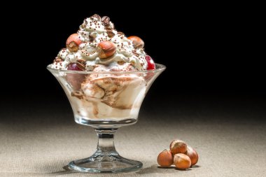 Hazelnut ice cream in glass bowl clipart